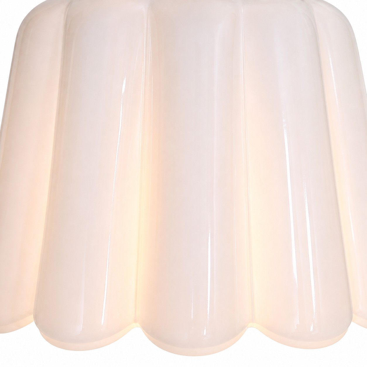 Close view of white scalloped ceramic shade